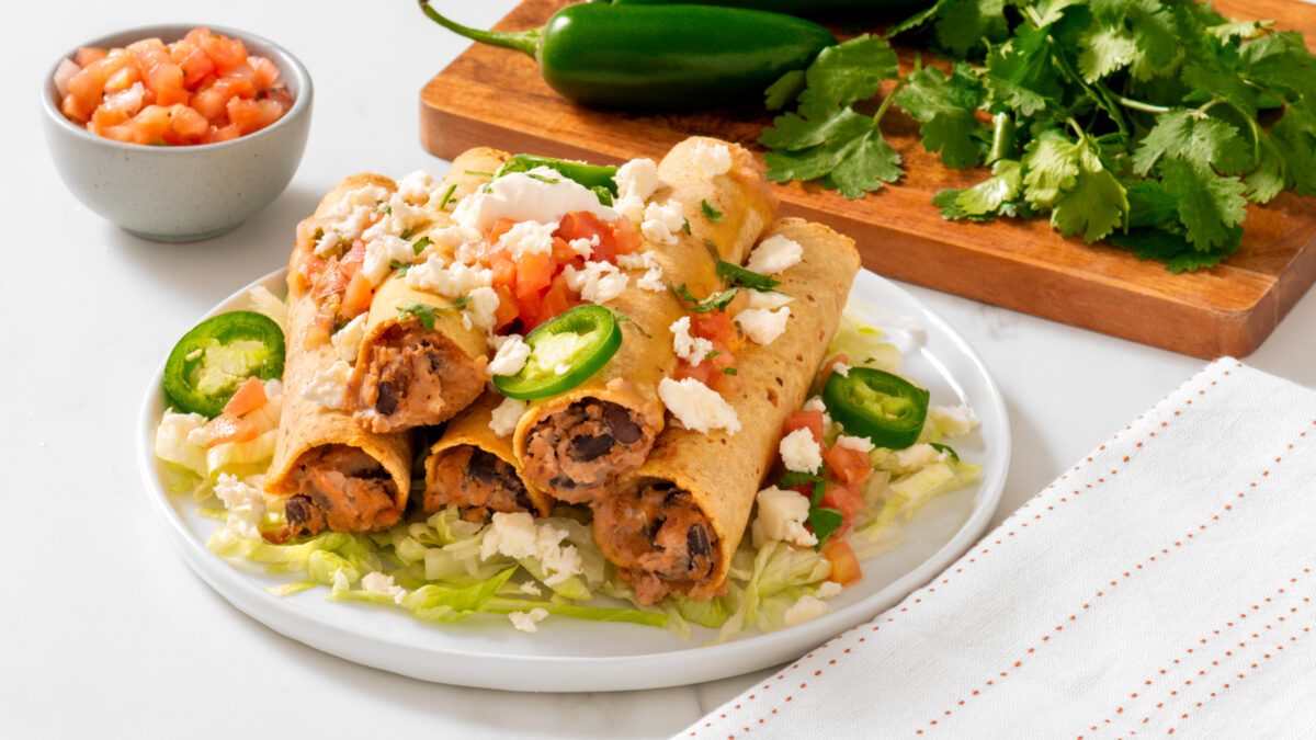 Cheesy Refried Bean Baked Taquitos